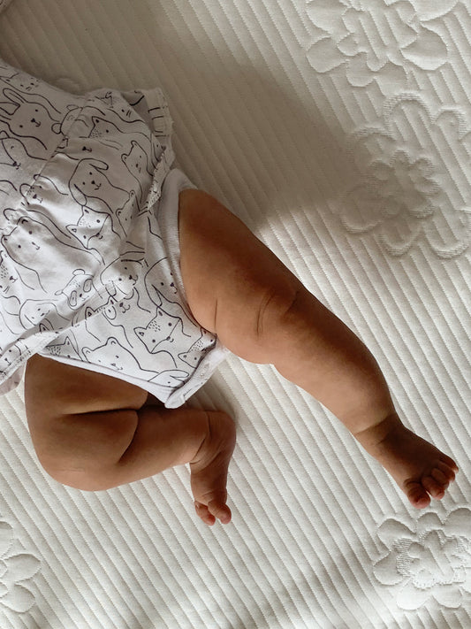 Baby playing on Sleepout Crib Mattress