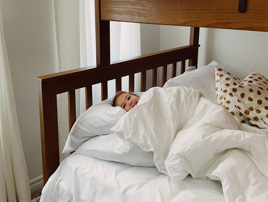 toddler sleeping in bright room during the day